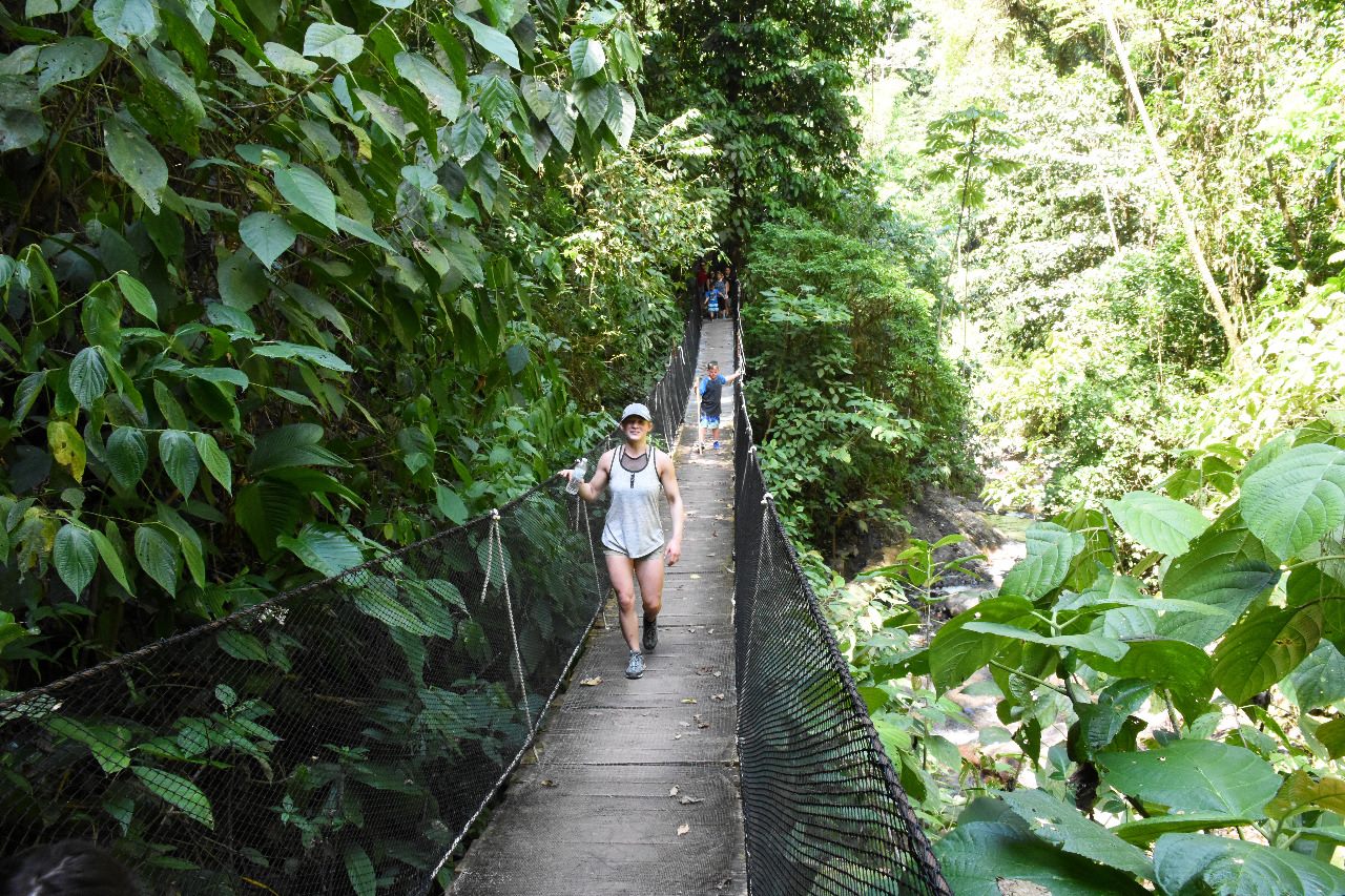 Guest crossing a suspension bridge at Rainmaker Park